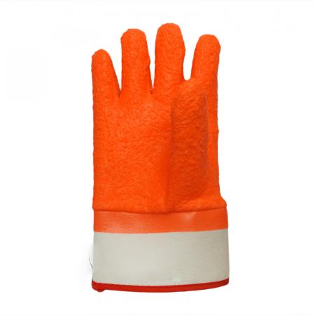 Orangefarbene PVC-Chips auf der Sicherheitsmanschette für Handwarmhandschuhe